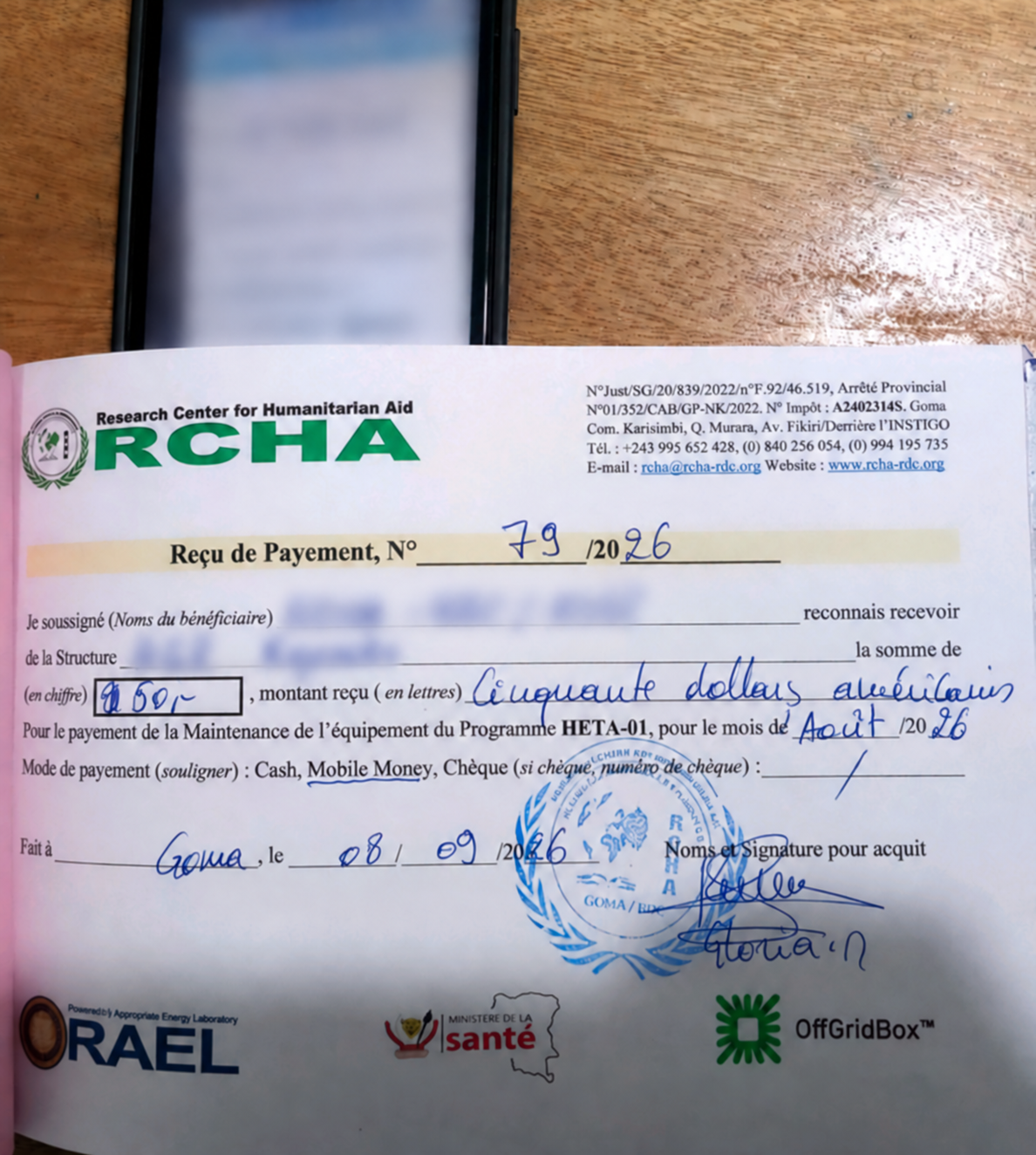 Redacted payment receipt with an associated mobile-money confirmation