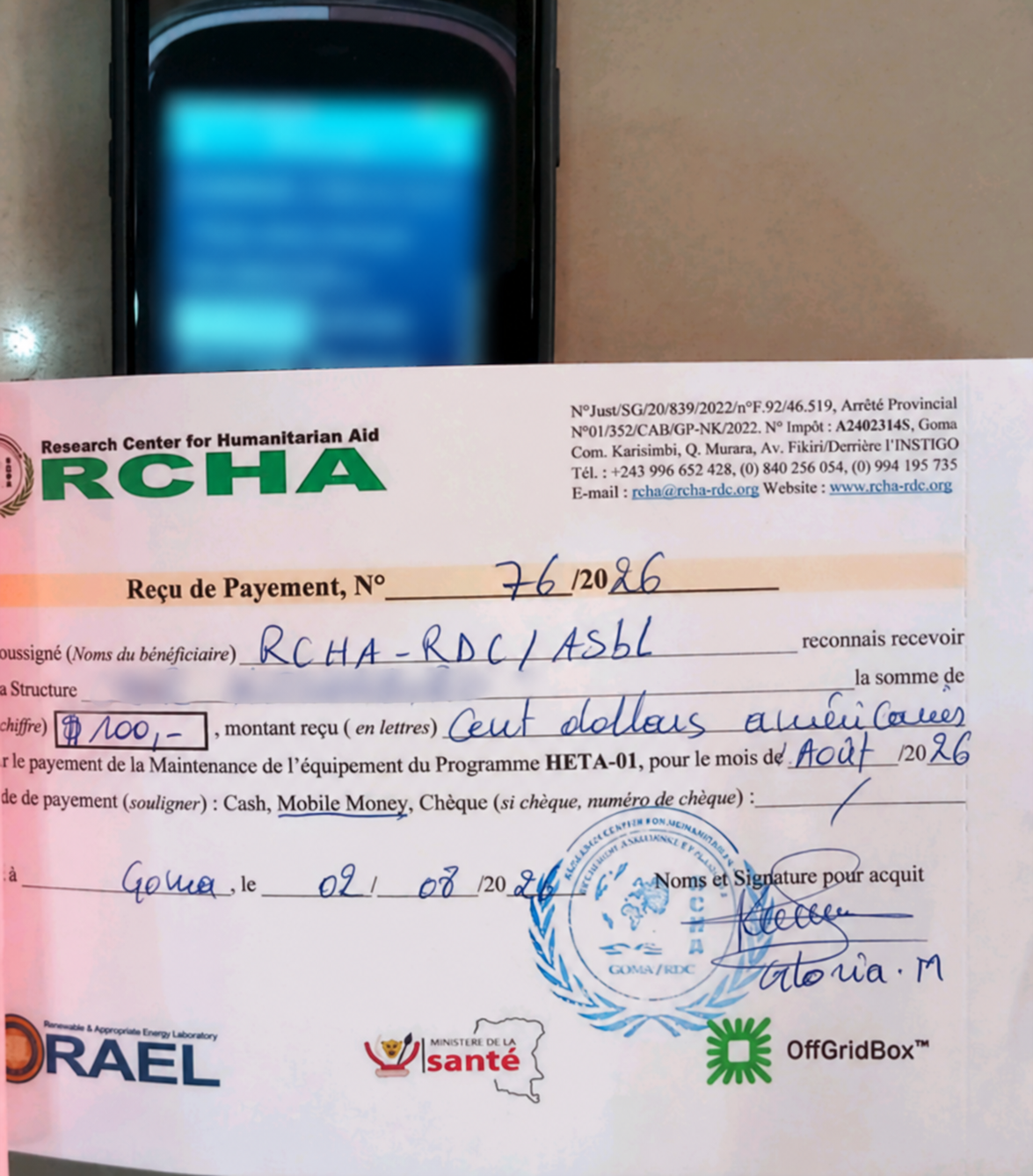 Redacted payment receipt with an associated mobile-money confirmation
